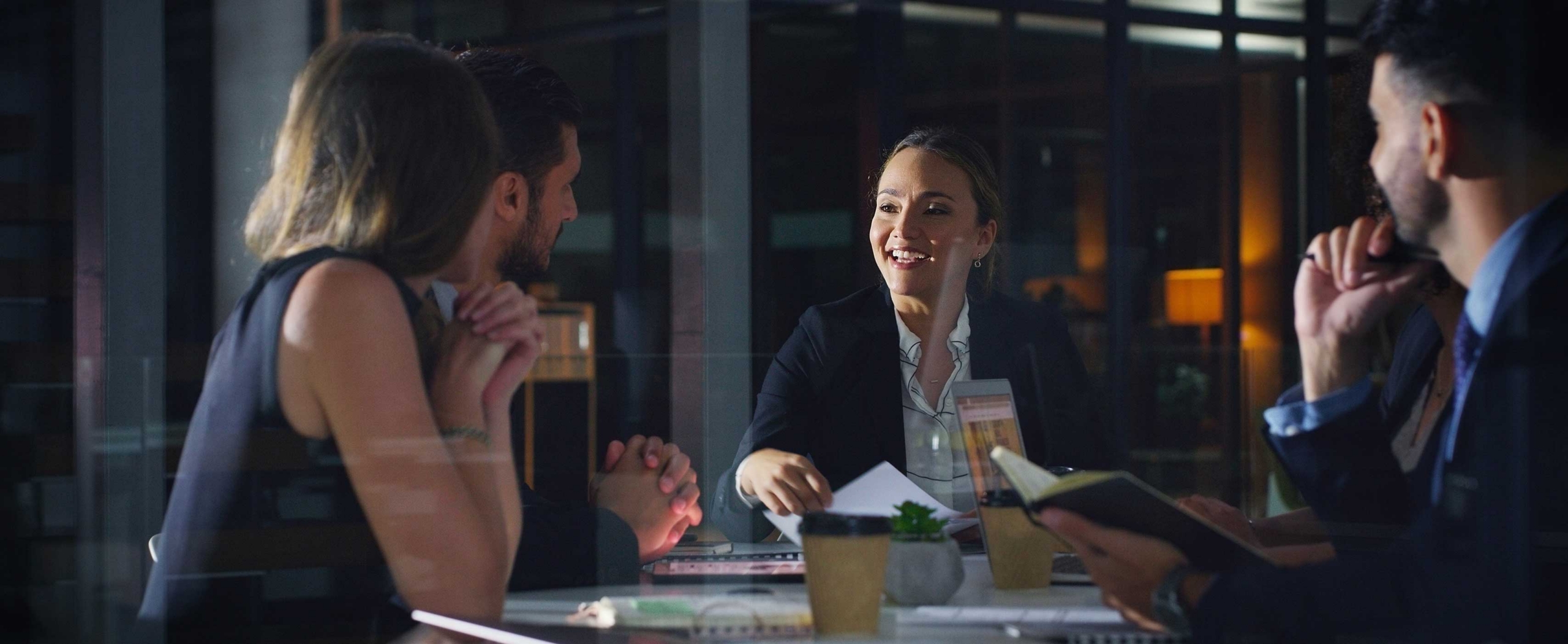 Supreme Alliance professionals collaborating during a business meeting.