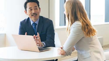 Financial advisor meeting with a client to discuss financial planning and investment strategies.