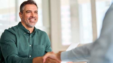 Financial advisor supporting a client through the final transition process and reviewing their financial plan.