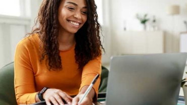Financial advisor meeting with a client to review progress and provide ongoing financial guidance after the transition.