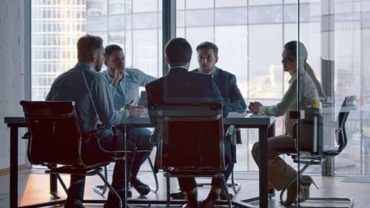 Financial advisor and client discussing long-term financial goals and ongoing wealth management strategies.